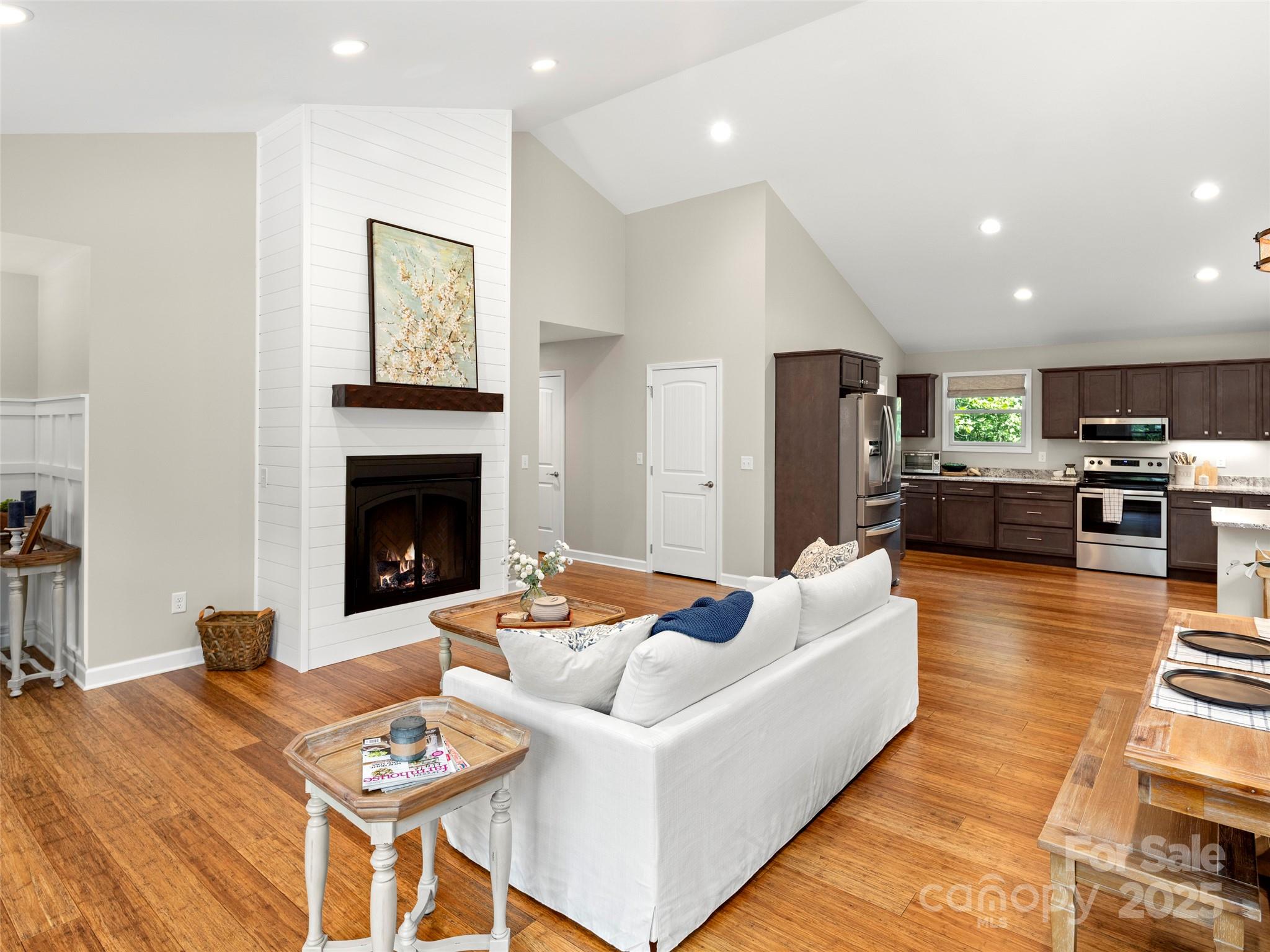 269 Adams Drive Clyde, NC 28721 - Photo 9 of 32 a living room with furniture and a fireplace