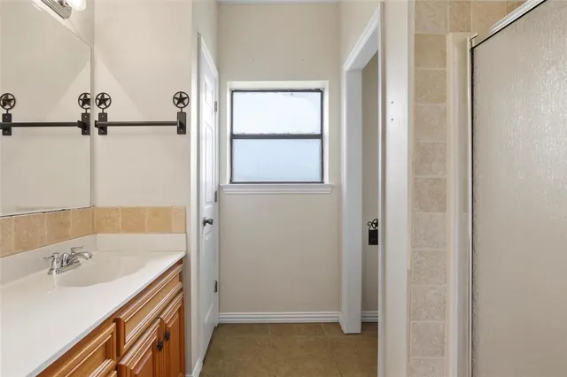 a bathroom with a tub and a sink