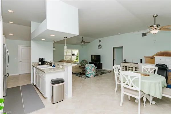 a view of a dining room with furniture and a livingroom