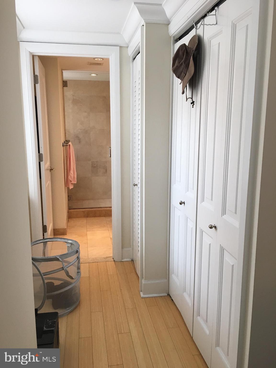 1701 Locust Street, Unit 1717 Philadelphia, PA 19103 - Photo 5 of 13 a view of a hallway with wooden floor and staircase