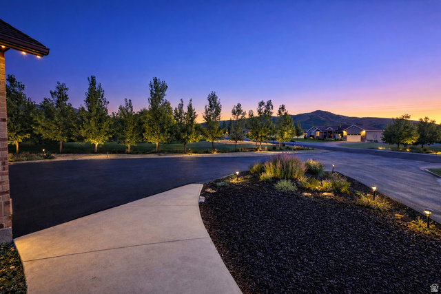 3054 West Ridgeline Road Stockton, UT 84071 - Photo 9 of 88 View of patio / terrace with a mountain view and driveway