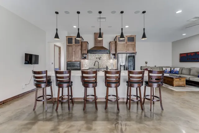 a dinning room and chairs in a kitchen