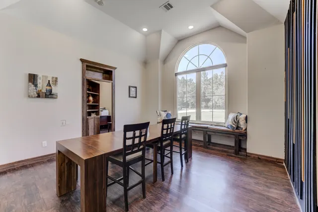 a view of a dining room with furniture window and wooden floor