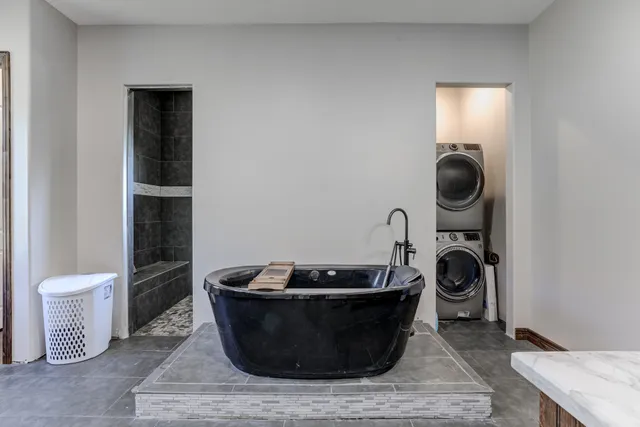 a bathroom with a sink double vanity and a mirror