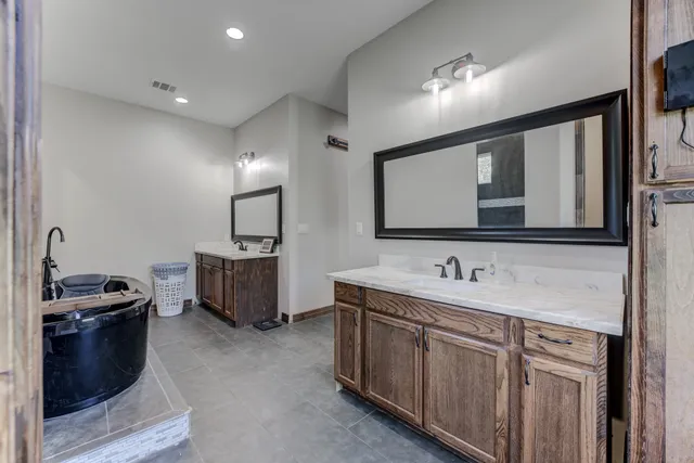 a bedroom with a bed and a couch