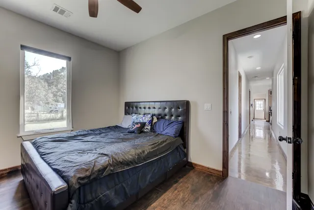 a en suite bathroom with a sink double vanity and a mirror