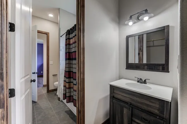 a bedroom with bed and a window