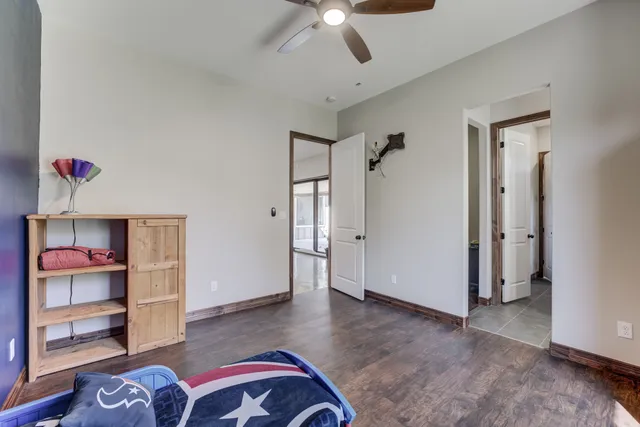 a view of a livingroom with furniture and hardwood floor