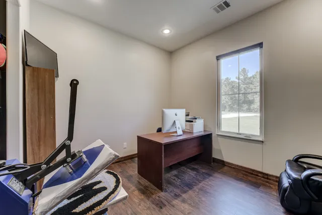 a room with gym equipment and a large window