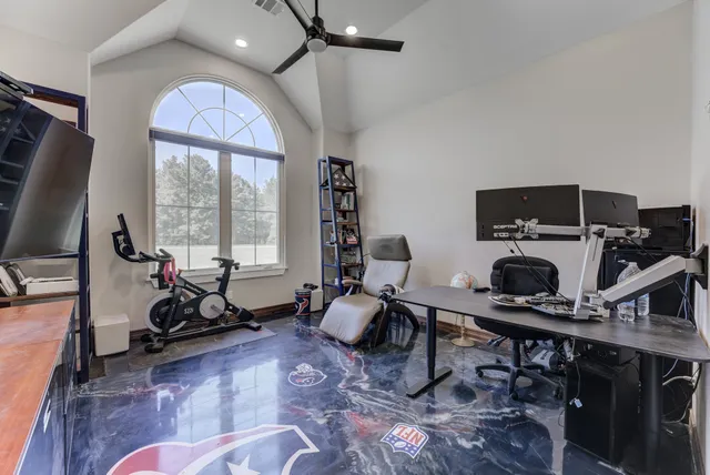 a room with furniture and a large mirror