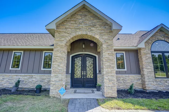 a front view of a house with garden