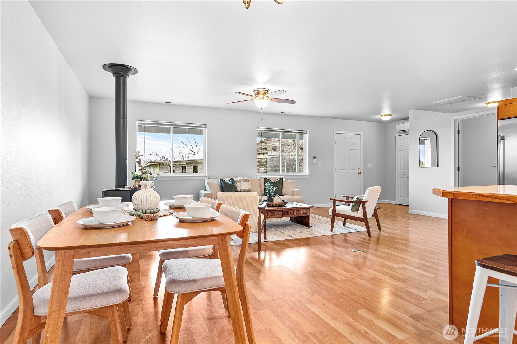 303 Hayes Street Nooksack, WA 98276 - Photo 11 of 40 a view of a dining room with furniture window and wooden floor