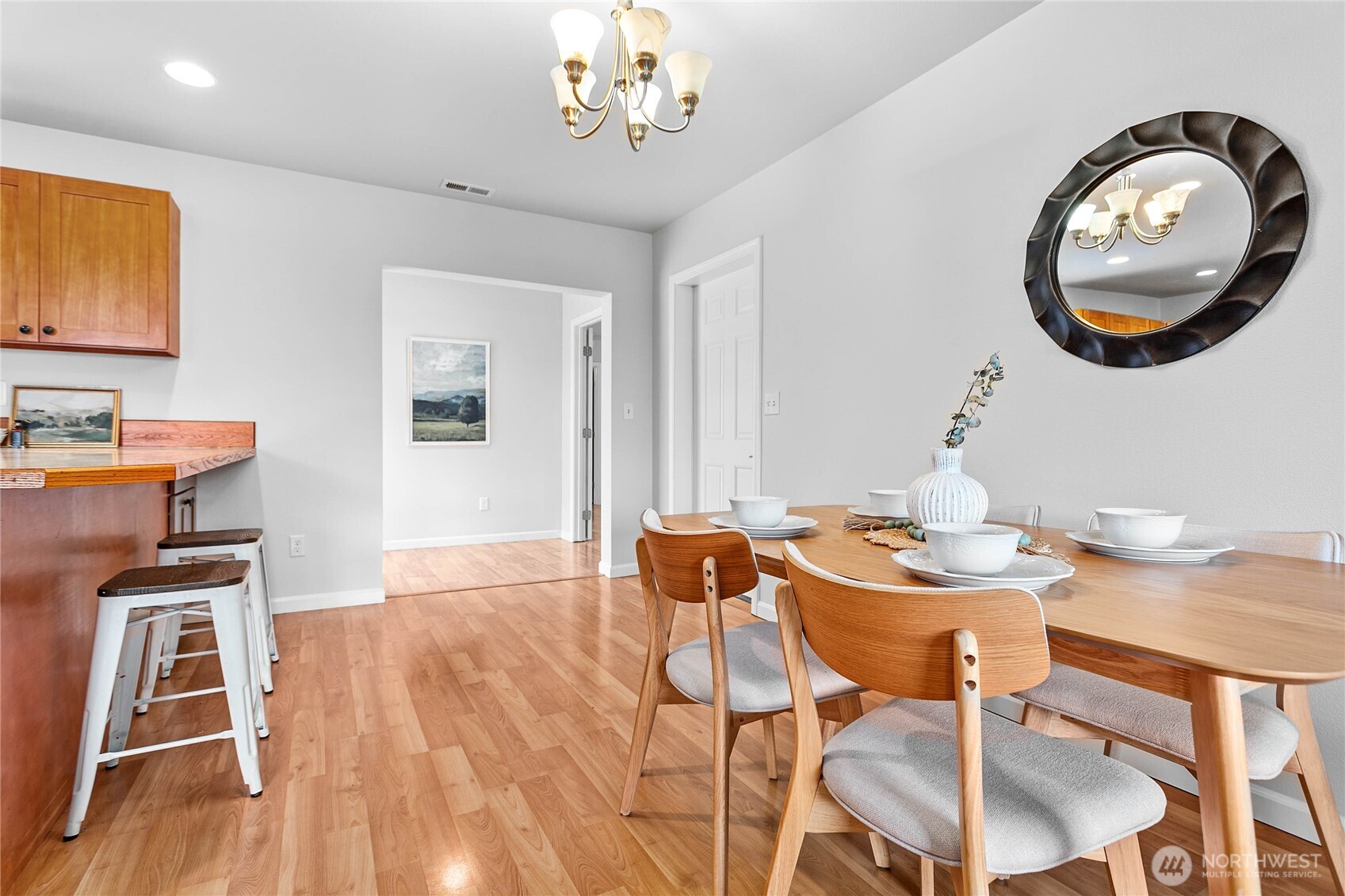 303 Hayes Street Nooksack, WA 98276 - Photo 22 of 40 a view of a dining room with furniture and chandelier