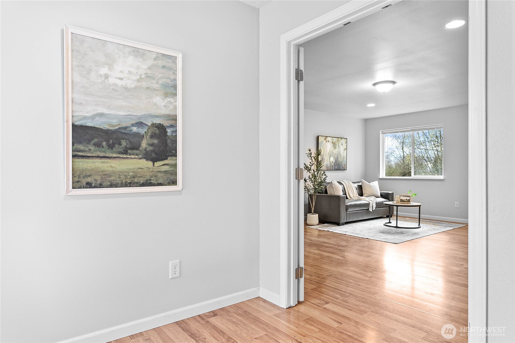 303 Hayes Street Nooksack, WA 98276 - Photo 23 of 40 a living room with furniture and a painting on the wall