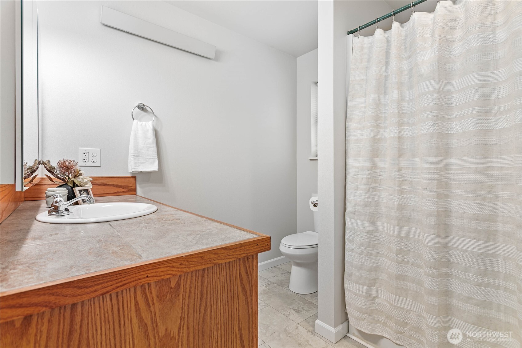 303 Hayes Street Nooksack, WA 98276 - Photo 26 of 40 a bathroom with a sink toilet and shower