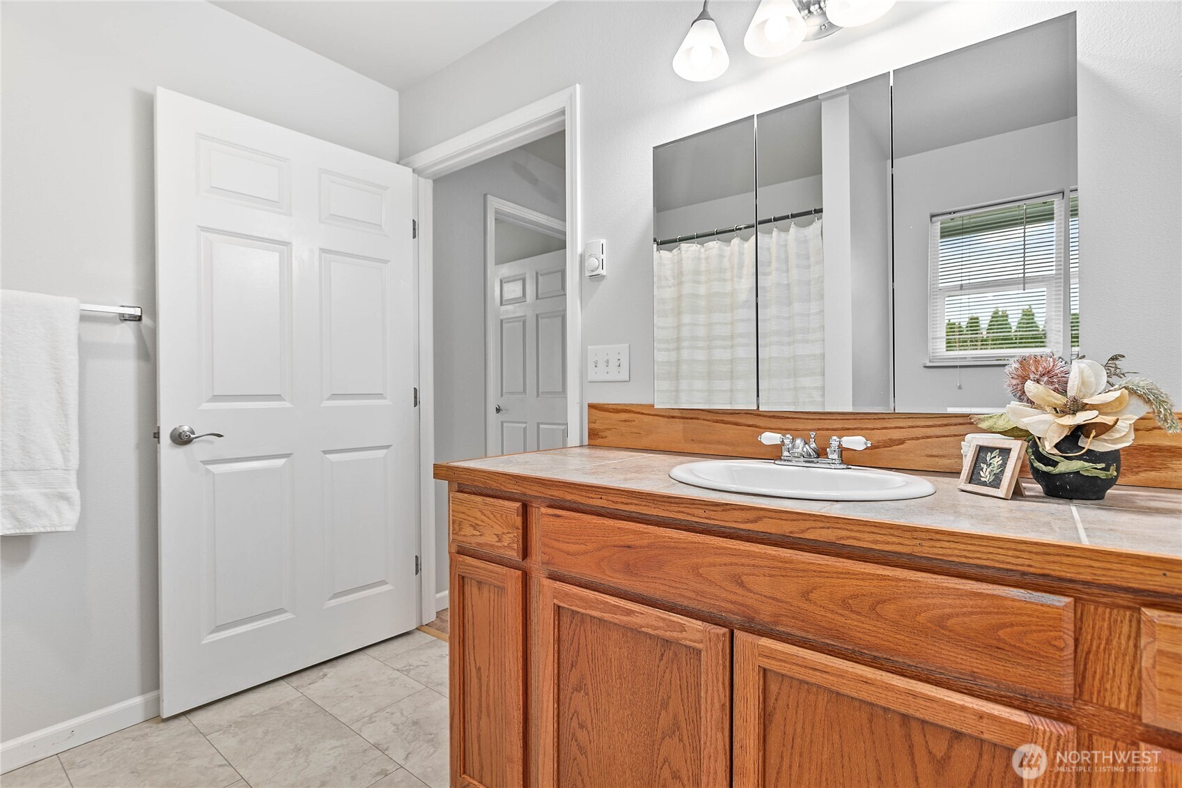 303 Hayes Street Nooksack, WA 98276 - Photo 27 of 40 a bathroom with a sink and a mirror