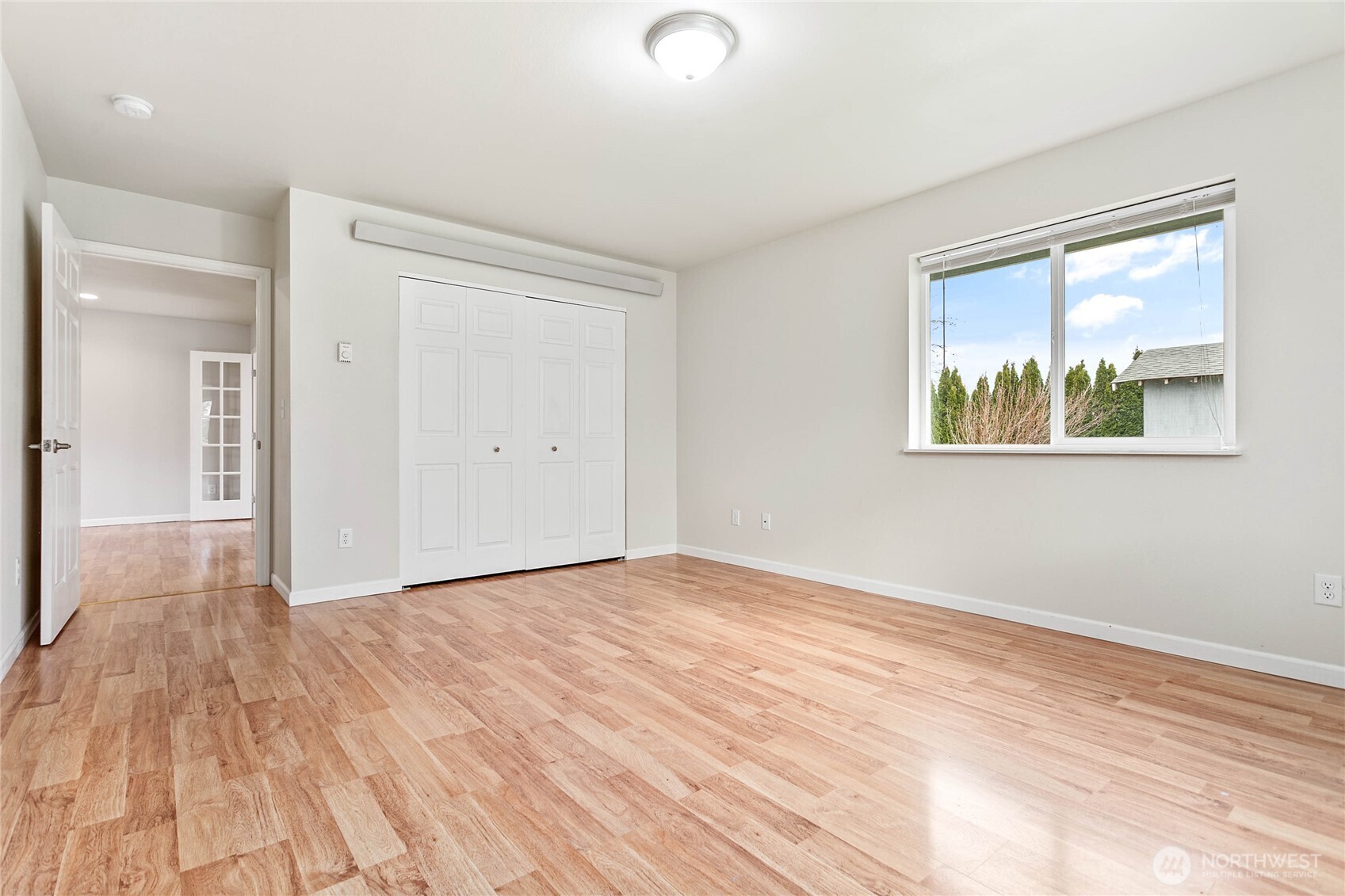 303 Hayes Street Nooksack, WA 98276 - Photo 29 of 40 a view of an empty room with wooden floor and a window