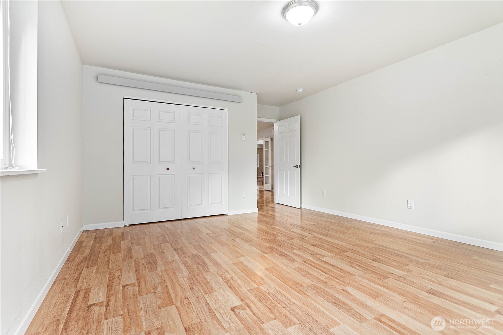 303 Hayes Street Nooksack, WA 98276 - Photo 31 of 40 a view of an empty room with wooden floor
