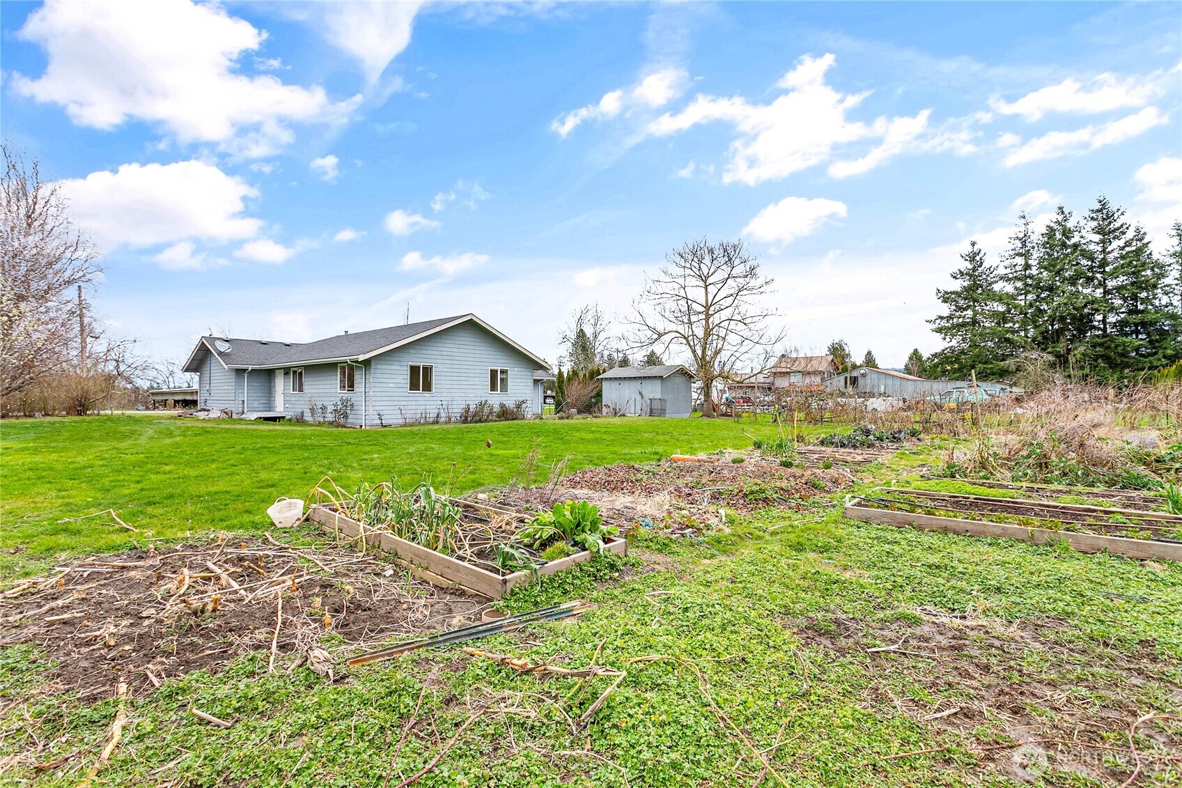 303 Hayes Street Nooksack, WA 98276 - Photo 35 of 40 a view of house with garden