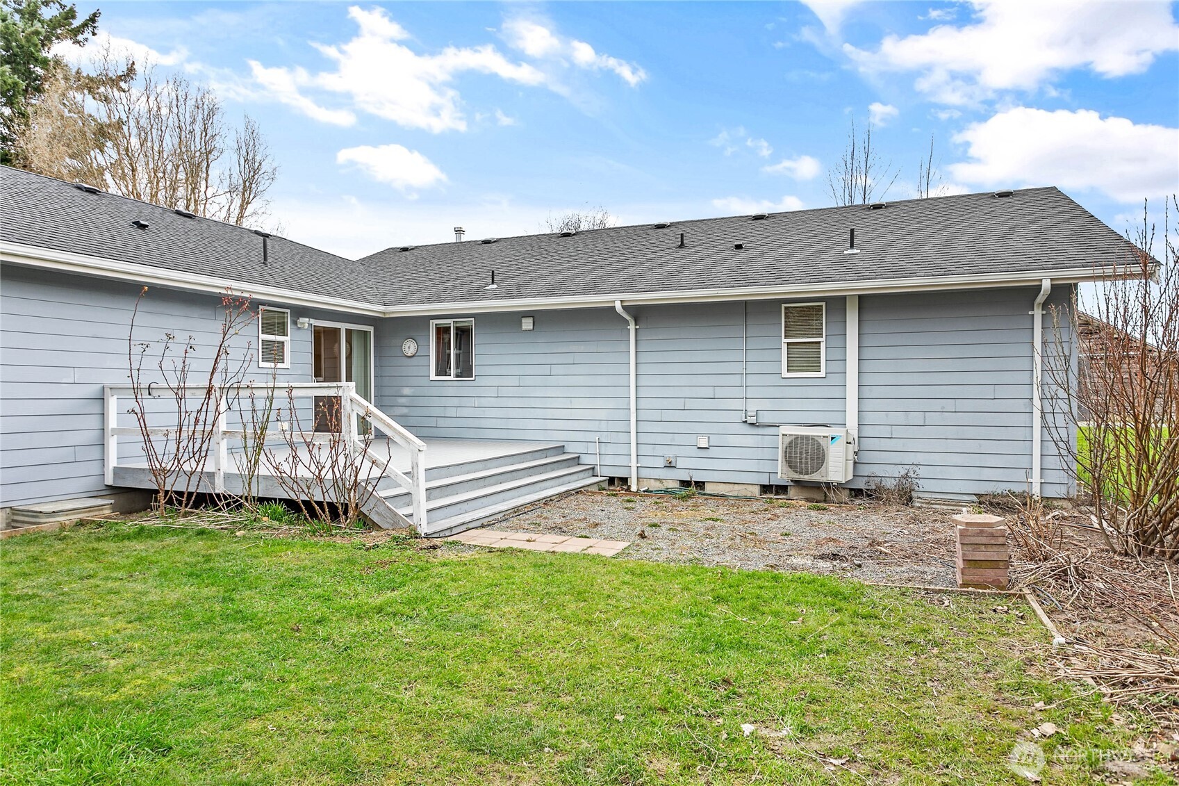 303 Hayes Street Nooksack, WA 98276 - Photo 38 of 40 a backyard of a house with a small yard and large tree