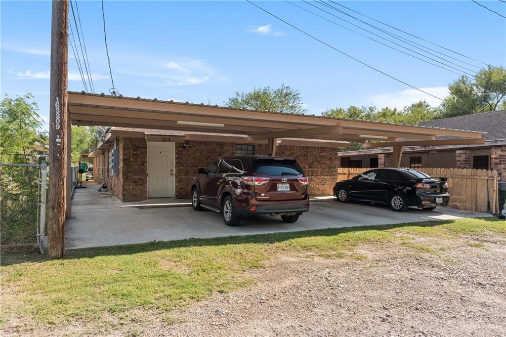 a view of a car parked in back of a house