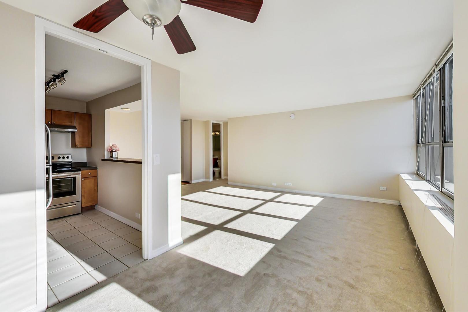 655 West Irving Park Road, Unit 1403 Chicago, IL 60613 - Photo 14 of 36 a view of kitchen with sink and refrigerator