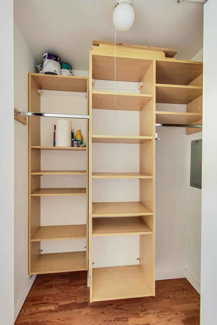 655 West Irving Park Road, Unit 1403 Chicago, IL 60613 - Photo 23 of 36 a view of walk in closet with empty racks