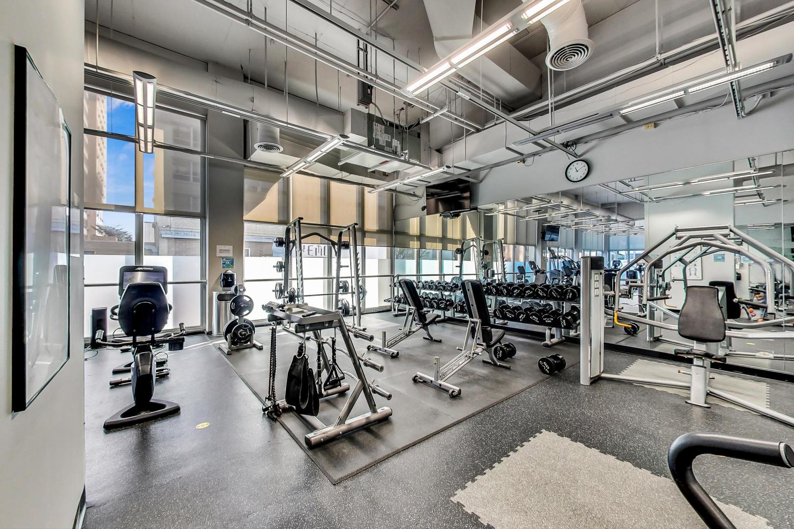 655 West Irving Park Road, Unit 1403 Chicago, IL 60613 - Photo 26 of 36 a view of a room with gym equipment