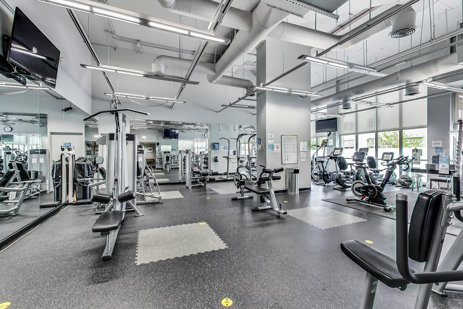 655 West Irving Park Road, Unit 1403 Chicago, IL 60613 - Photo 27 of 36 a view of a room with gym equipment