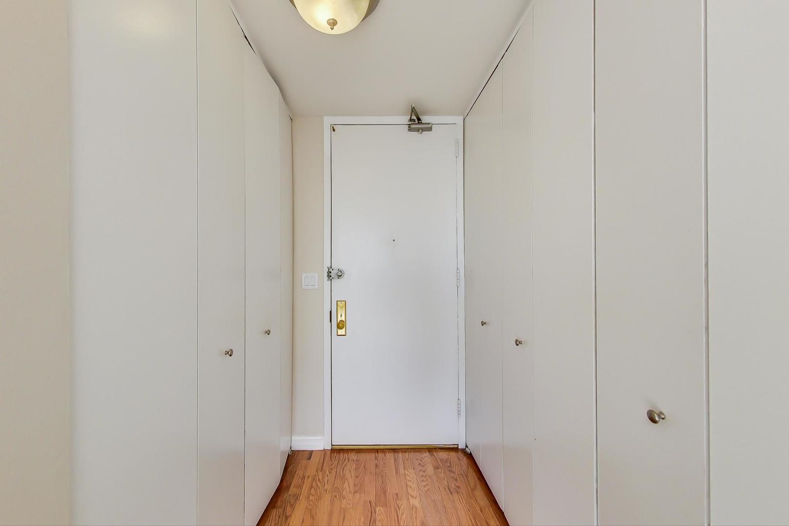 655 West Irving Park Road, Unit 1403 Chicago, IL 60613 - Photo 9 of 36 a view of a hallway with wooden floor
