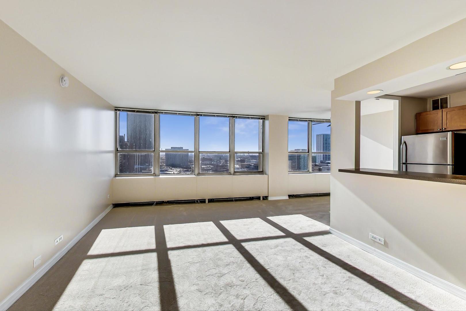 655 West Irving Park Road, Unit 1403 Chicago, IL 60613 - Photo 10 of 36 a view of an empty room with a window