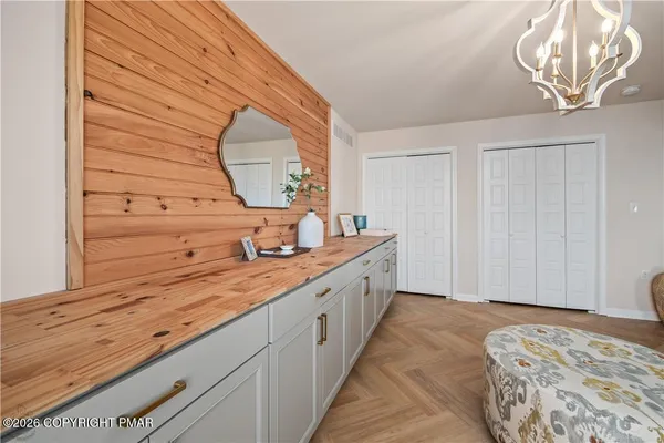 a spacious bathroom with a sink and a mirror