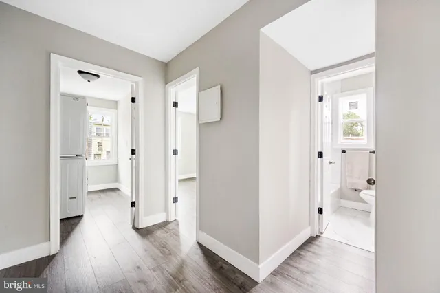 wooden floor with white walls