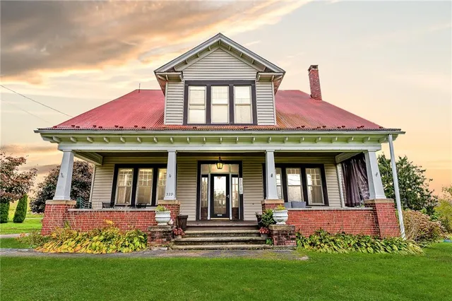 a front view of a house with garden