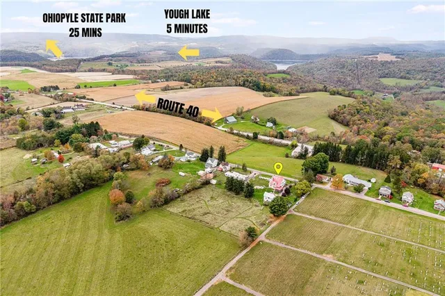 a aerial view of a house with a yard
