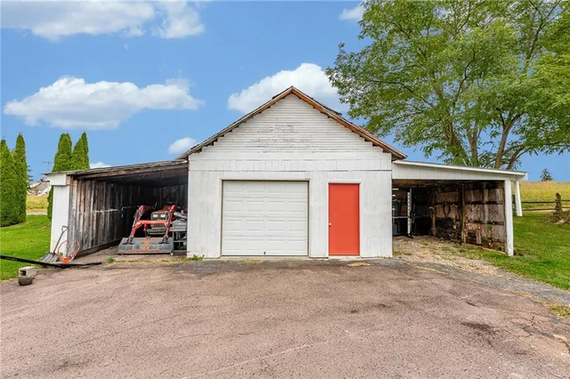 a view of house with backyard