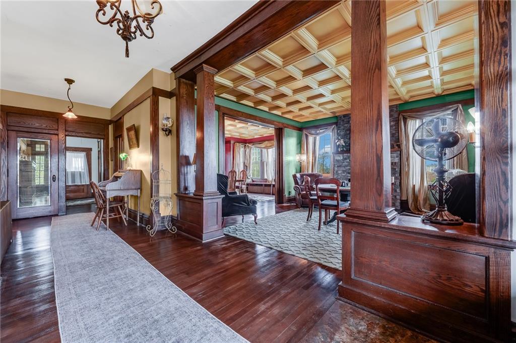 539 Main Street Addison, PA 15411 - Photo 23 of 50 a living room with furniture a chandelier and a dining table