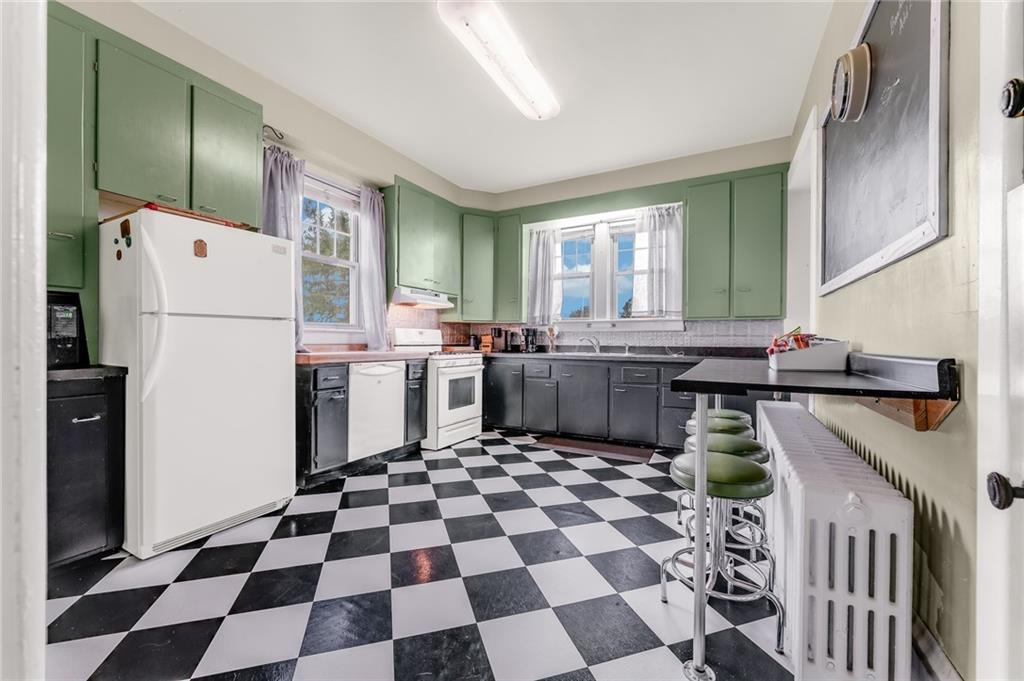 539 Main Street Addison, PA 15411 - Photo 32 of 50 a kitchen with stainless steel appliances granite countertop a refrigerator and a stove top oven