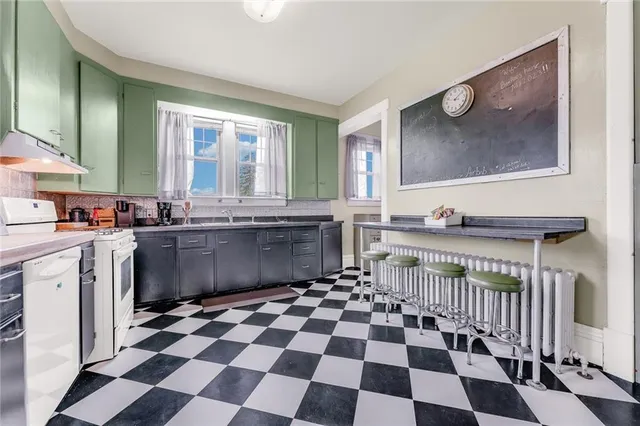 a bedroom with bed and wooden floor