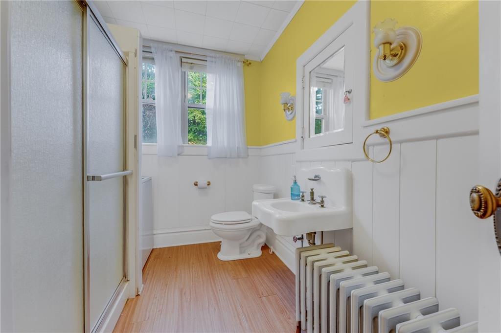 539 Main Street Addison, PA 15411 - Photo 36 of 50 a bathroom with a sink a toilet and a mirror