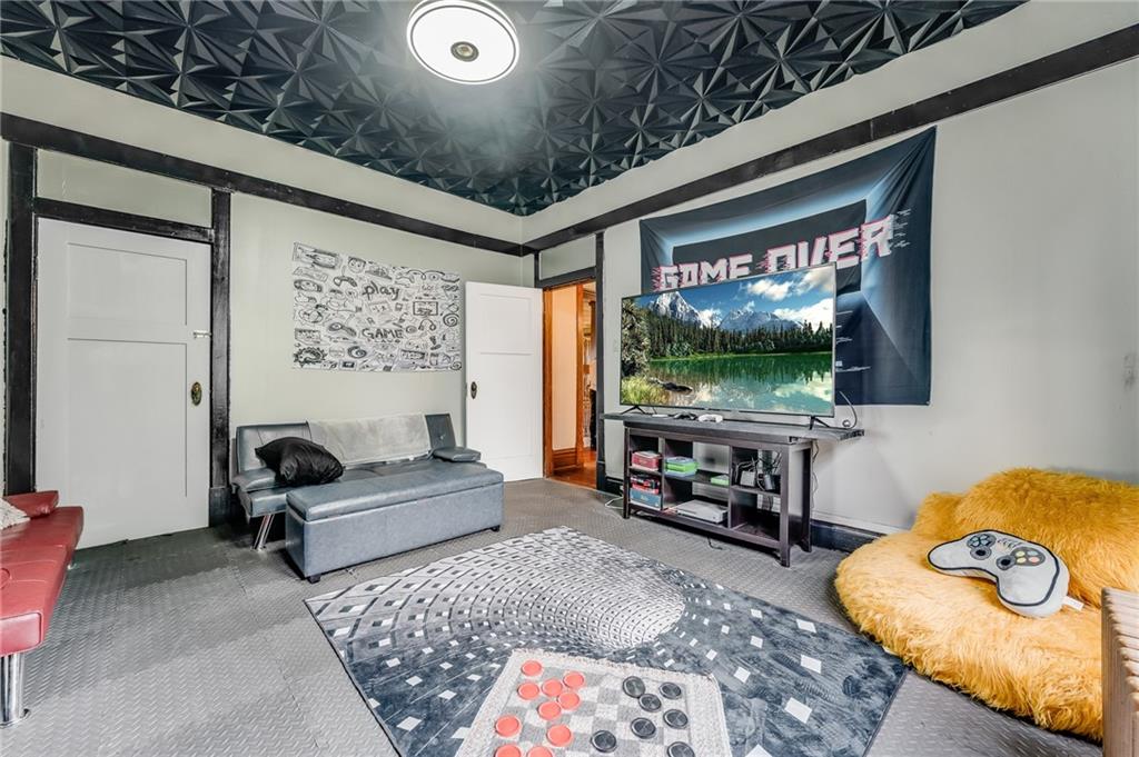 539 Main Street Addison, PA 15411 - Photo 38 of 50 a living room with furniture and a flat screen tv