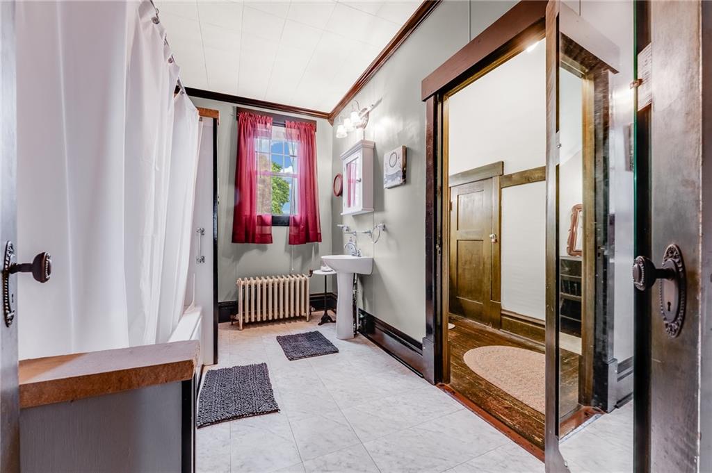 539 Main Street Addison, PA 15411 - Photo 48 of 50 a bedroom with a bed and a mirror