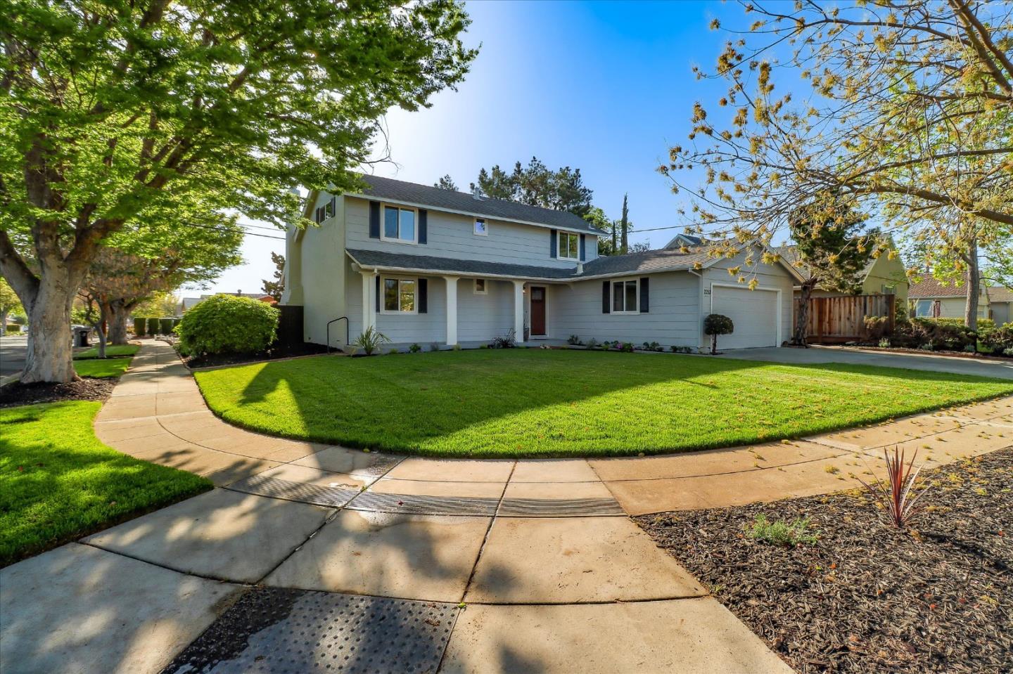 2232 Montezuma Drive Campbell, CA 95008 - Photo 3 of 34 a view of a white house with a big yard plants and large trees