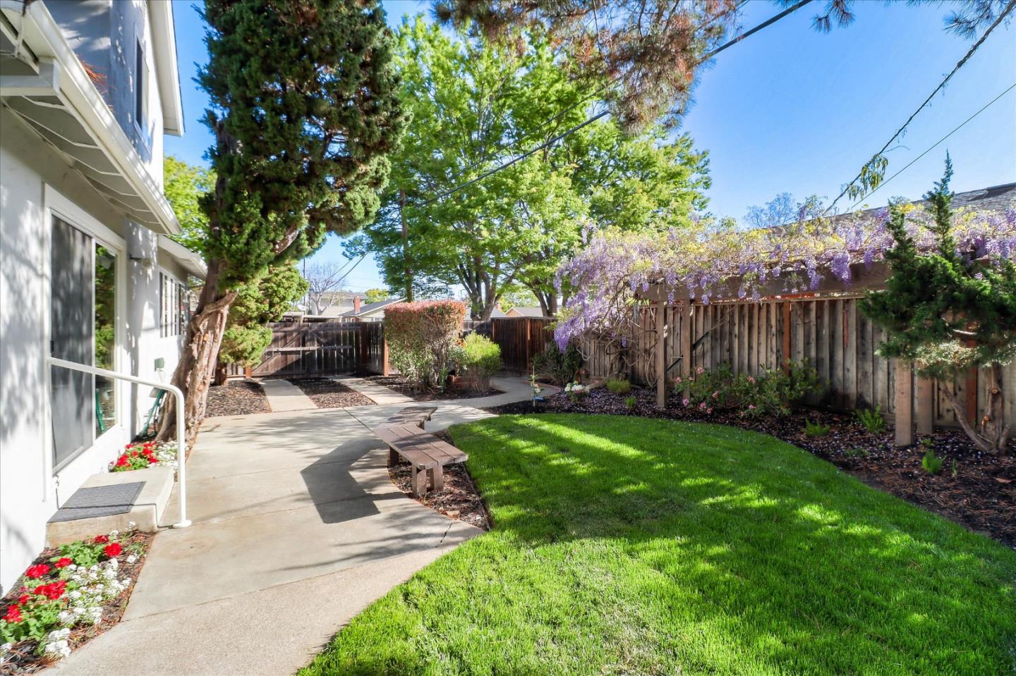 2232 Montezuma Drive Campbell, CA 95008 - Photo 33 of 34 a view of a patio with table and chairs potted plants and large tree