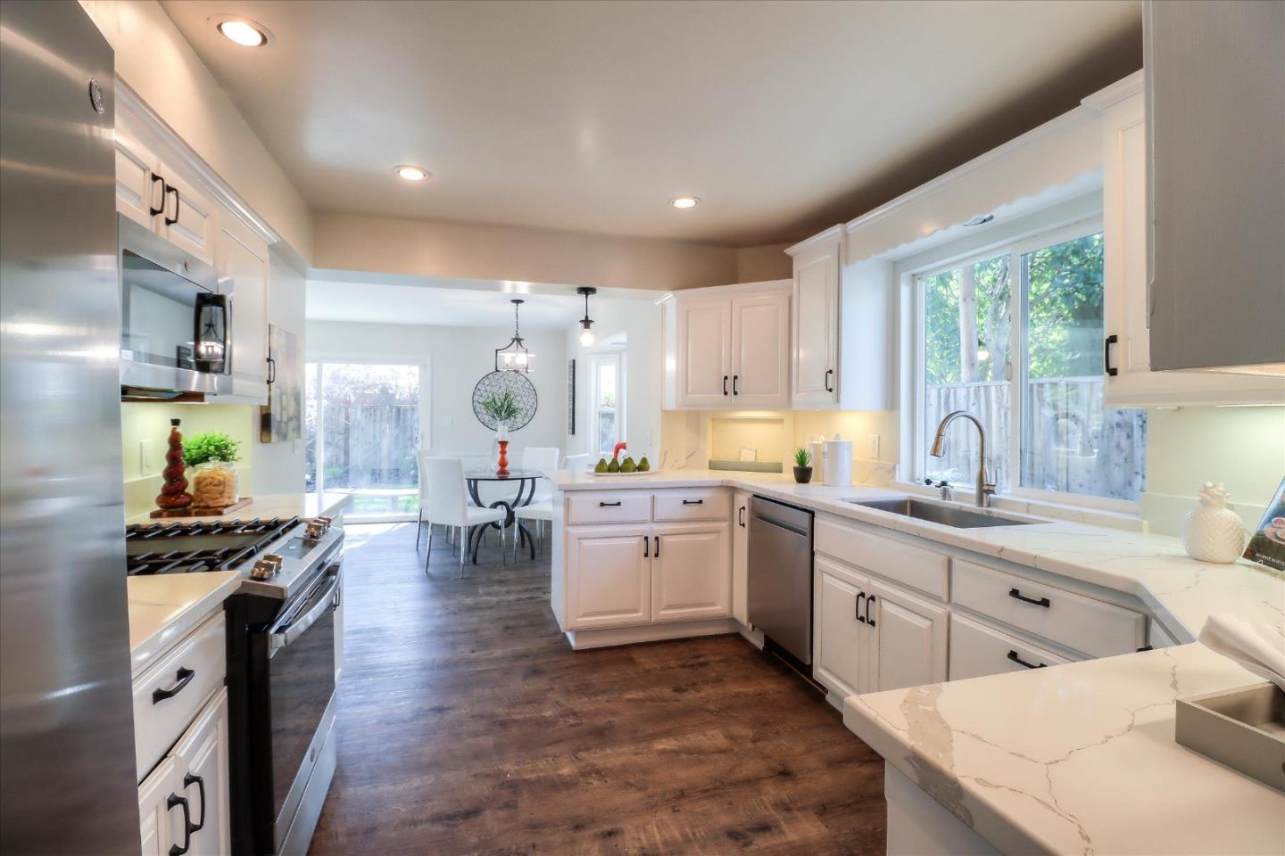 2232 Montezuma Drive Campbell, CA 95008 - Photo 8 of 34 a large kitchen with lots of counter space and stainless steel appliances