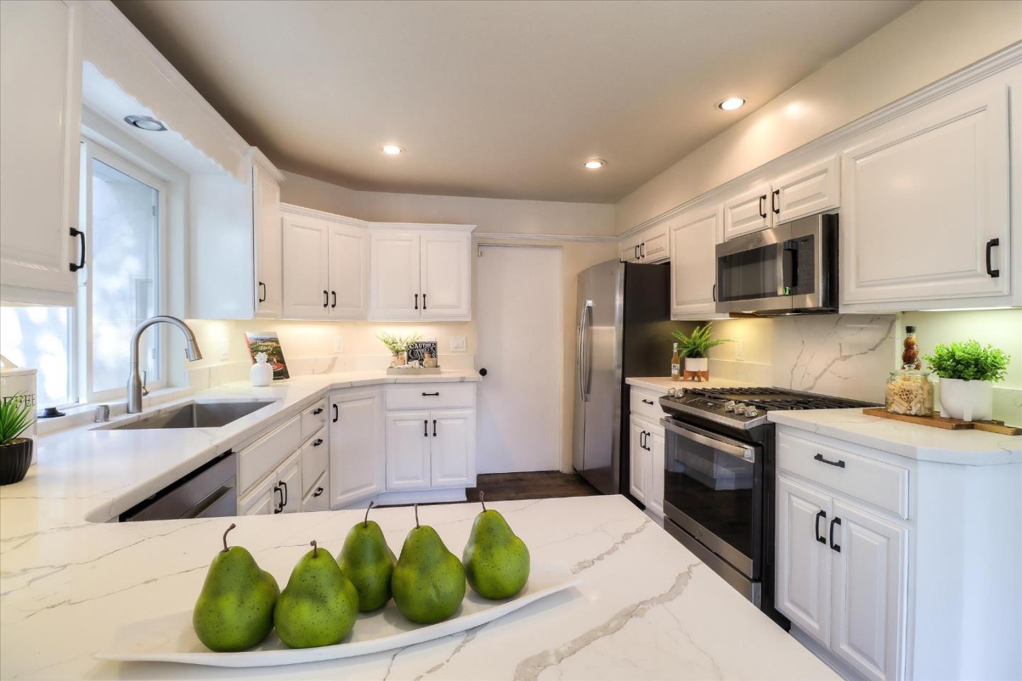 2232 Montezuma Drive Campbell, CA 95008 - Photo 9 of 34 a kitchen with stainless steel appliances granite countertop a sink a stove and a refrigerator