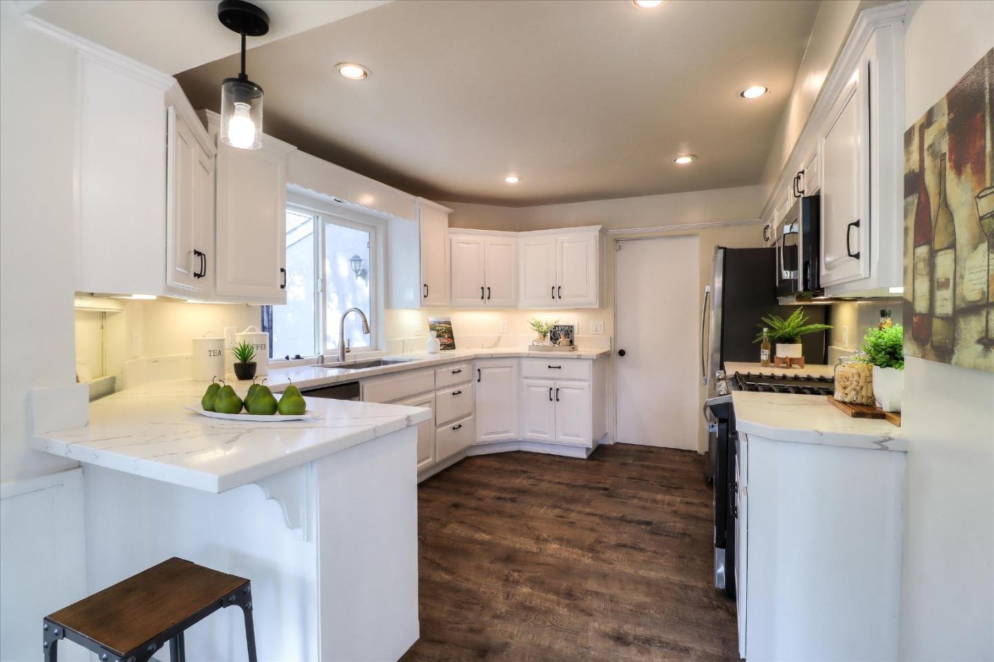 2232 Montezuma Drive Campbell, CA 95008 - Photo 10 of 34 a kitchen with stainless steel appliances kitchen island granite countertop a sink a stove a refrigerator cabinets and chairs