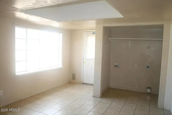 a view of an empty room with a window