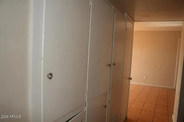 a bathroom with a shower and a door