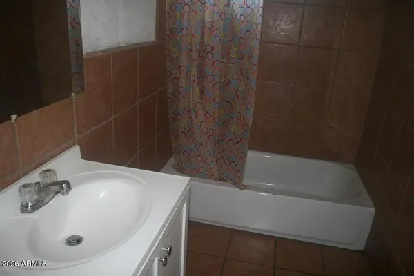a bathroom with a sink and shower